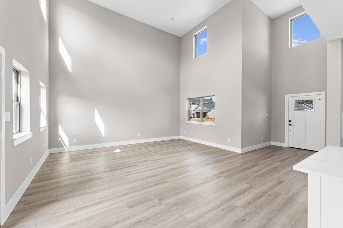 2515 Liguria Spring Spring, TX 77388 - Photo 11 of 15 a view of an empty room with window and wooden floor