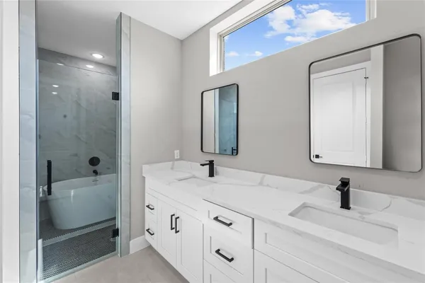 a white bath tub sitting in a bathroom