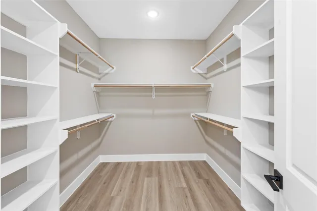 a bathroom with double sink and a mirror