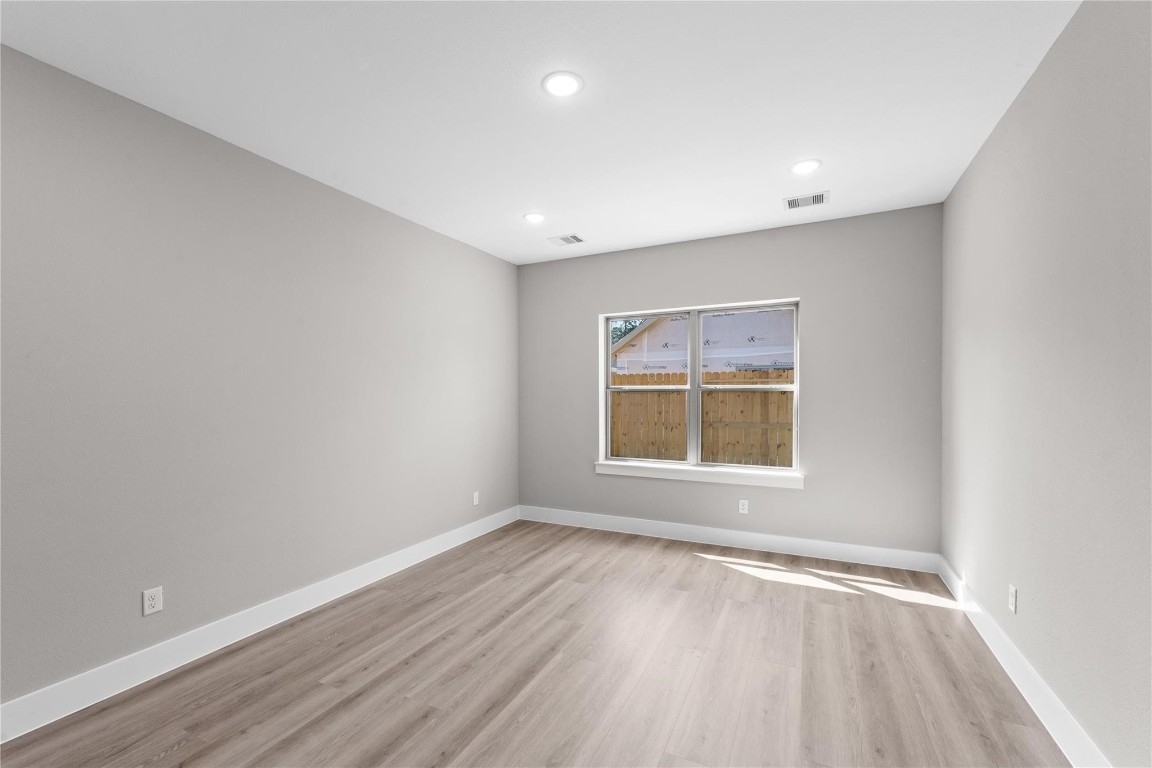 2515 Liguria Spring Spring, TX 77388 - Photo 9 of 15 an empty room with wooden floor and windows
