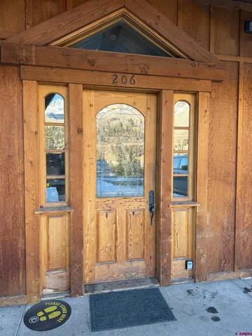 a view of a door and a window