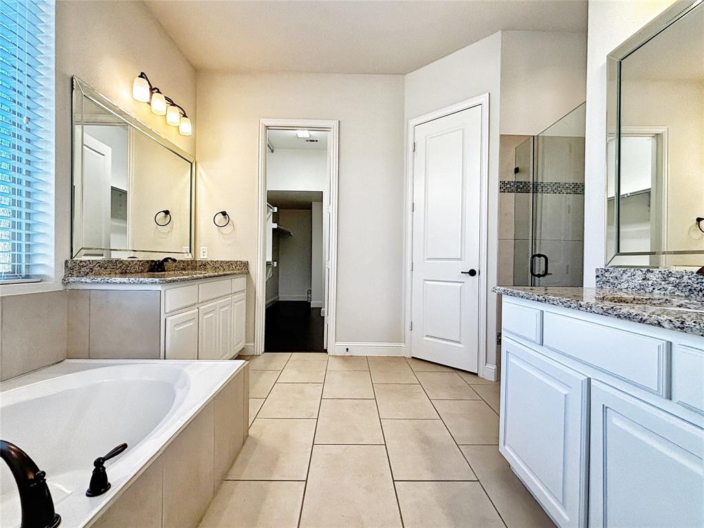 3037 Crestwater Ridge Keller, TX 76248 - Photo 15 of 25 a large white kitchen with a stove a sink dishwasher and a refrigerator