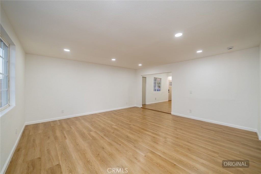 555 North Chestnut Avenue Rialto, CA 92376 - Photo 12 of 33 a view of an empty room with wooden floor