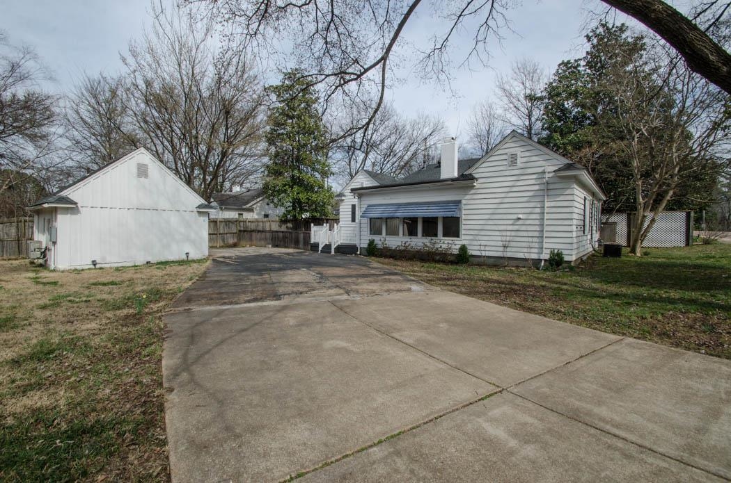 4572 Princeton Road Memphis, TN 38117 - Photo 2 of 24 View of home's exterior featuring a chimney and concrete driveway