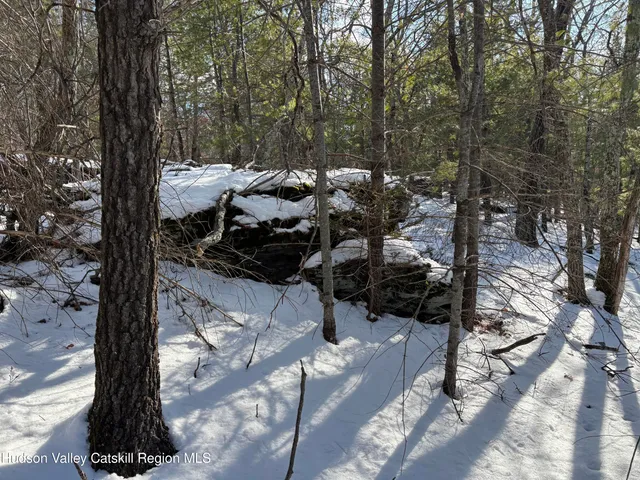 a view of large space with a wooden fence