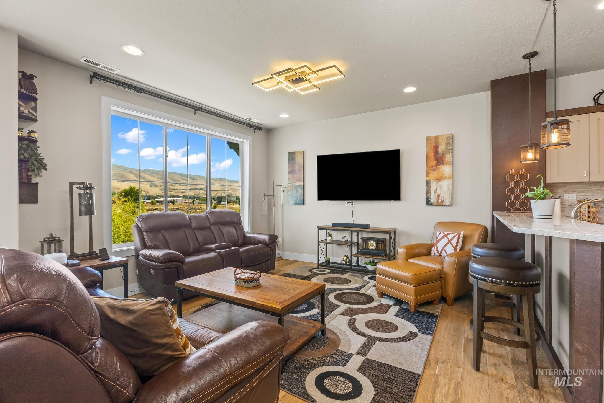 3362 East Exacta Lane Boise, ID 83716 - Photo 13 of 41 Living room with light wood-type flooring and recessed lighting