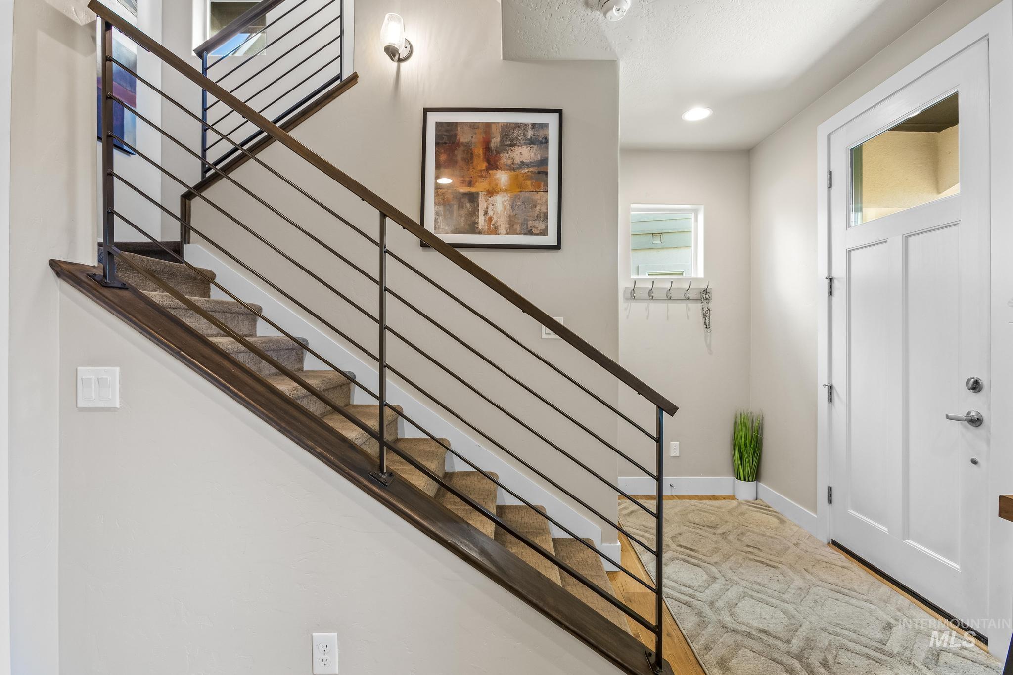 3362 East Exacta Lane Boise, ID 83716 - Photo 5 of 41 Foyer featuring stairs and baseboards