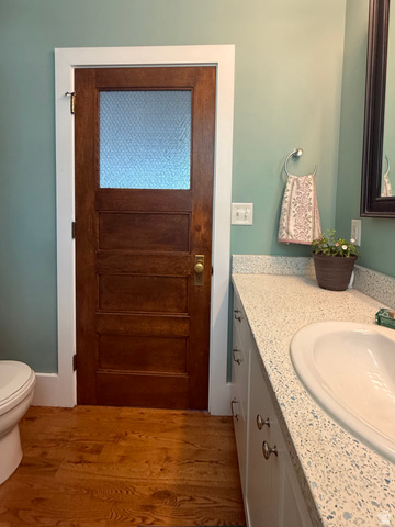 776 Canyon Road Hyde Park, UT 84318 - Photo 14 of 57 Wood-finish flooring complementing a rich wood door with privacy glass panel
