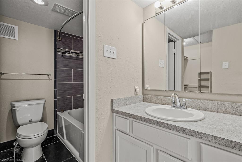 4557 North O'Connor Road, Unit 2281 Irving, TX 75062 - Photo 19 of 21 a bathroom with a sink toilet and shower