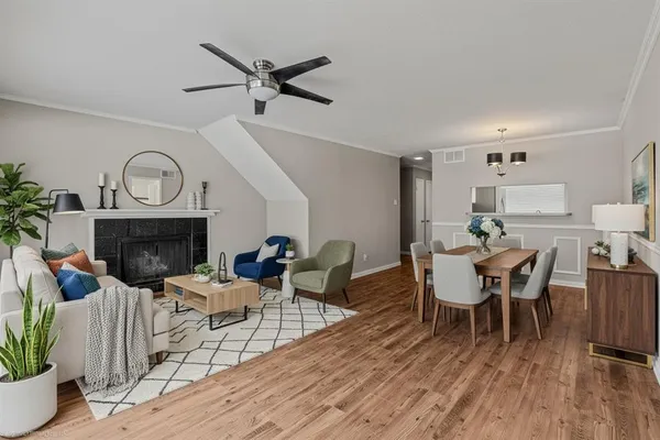a view of a dining room with furniture window and wooden floor