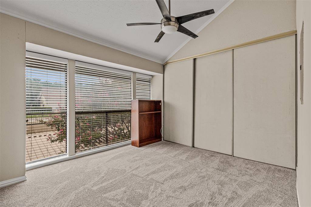 4557 North O'Connor Road, Unit 2281 Irving, TX 75062 - Photo 10 of 21 a view of an empty room with a fireplace and a window