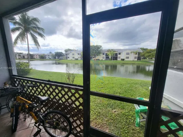 a kitchen with a sink and a refrigerator