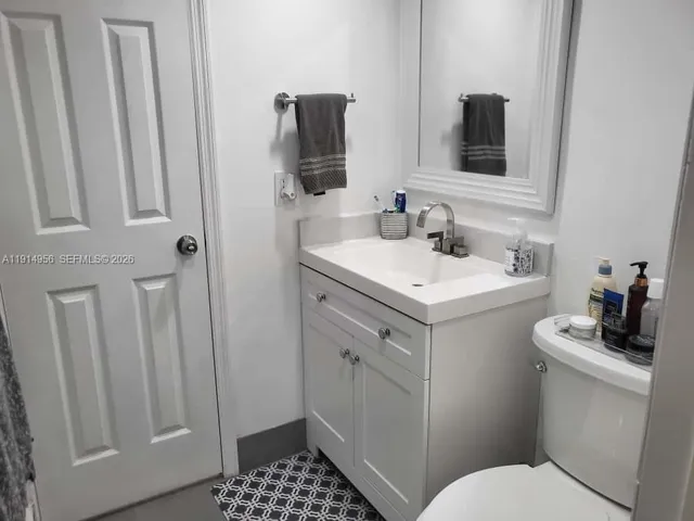 a bedroom with a bed and a closet