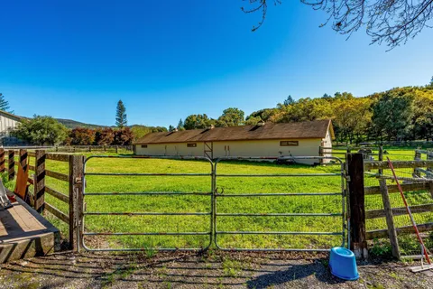 a view of a backyard with wooden floor and roof