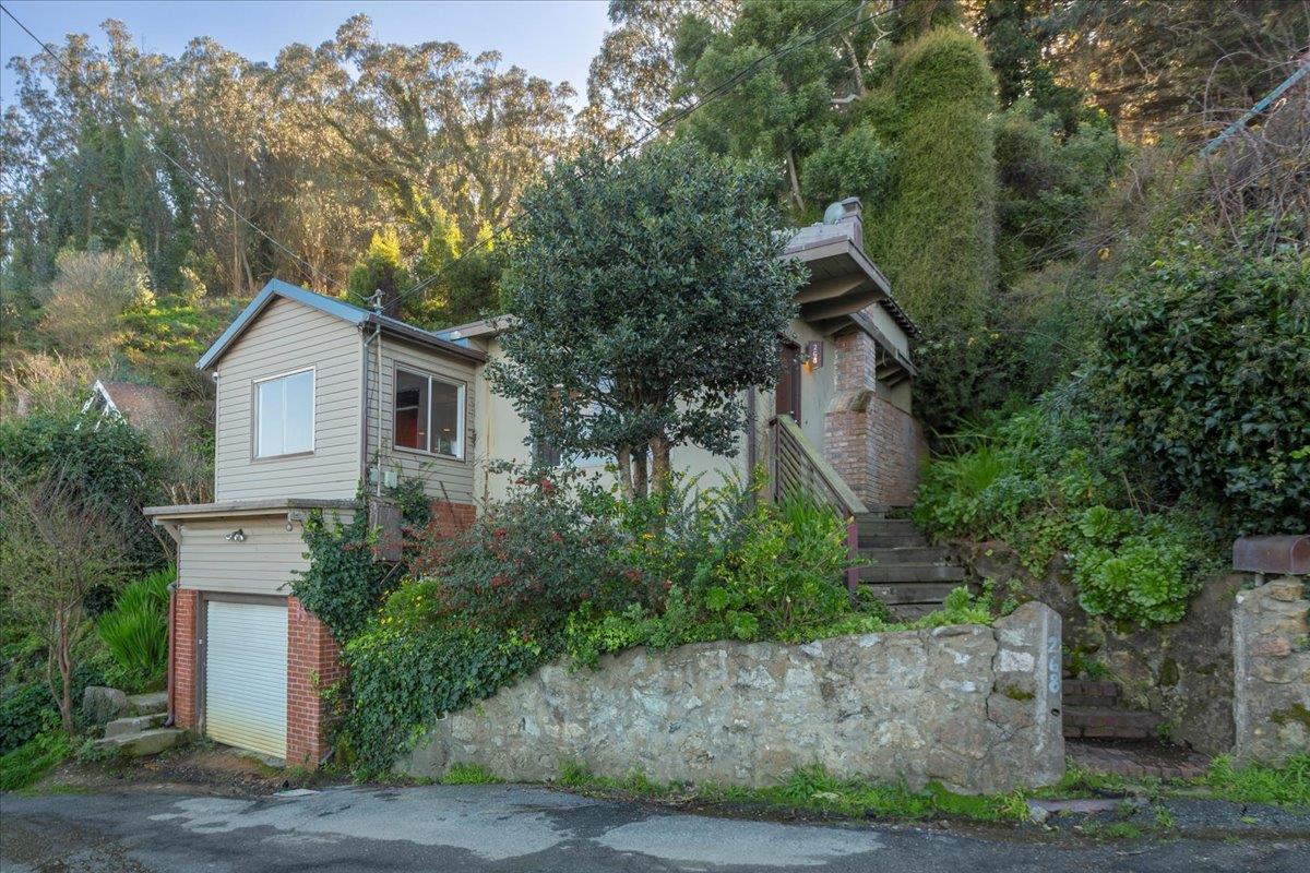 268 Olympian Way Pacifica, CA 94044 - Photo 1 of 23 a front view of a house with a garden