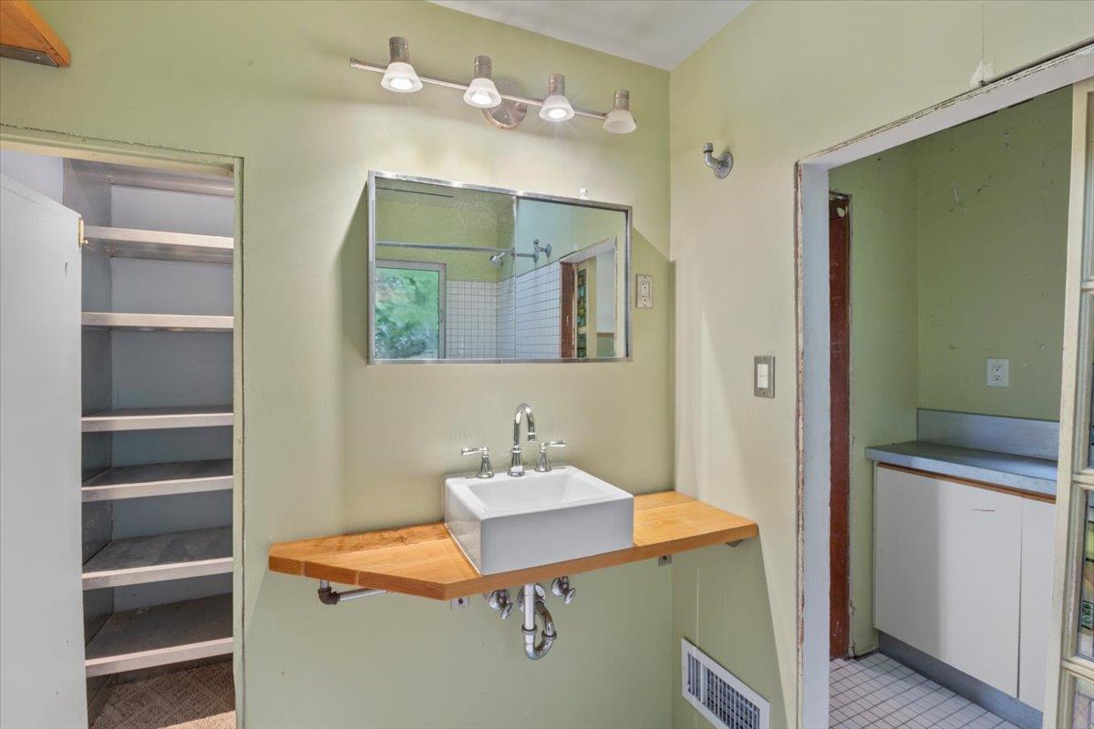 268 Olympian Way Pacifica, CA 94044 - Photo 14 of 23 a bathroom with a sink vanity and mirror