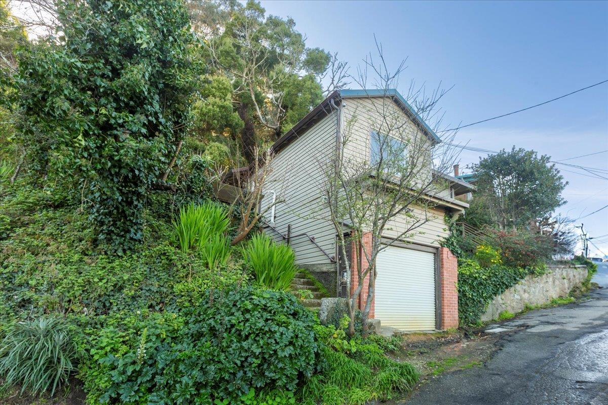 268 Olympian Way Pacifica, CA 94044 - Photo 17 of 23 a front view of a house with garden