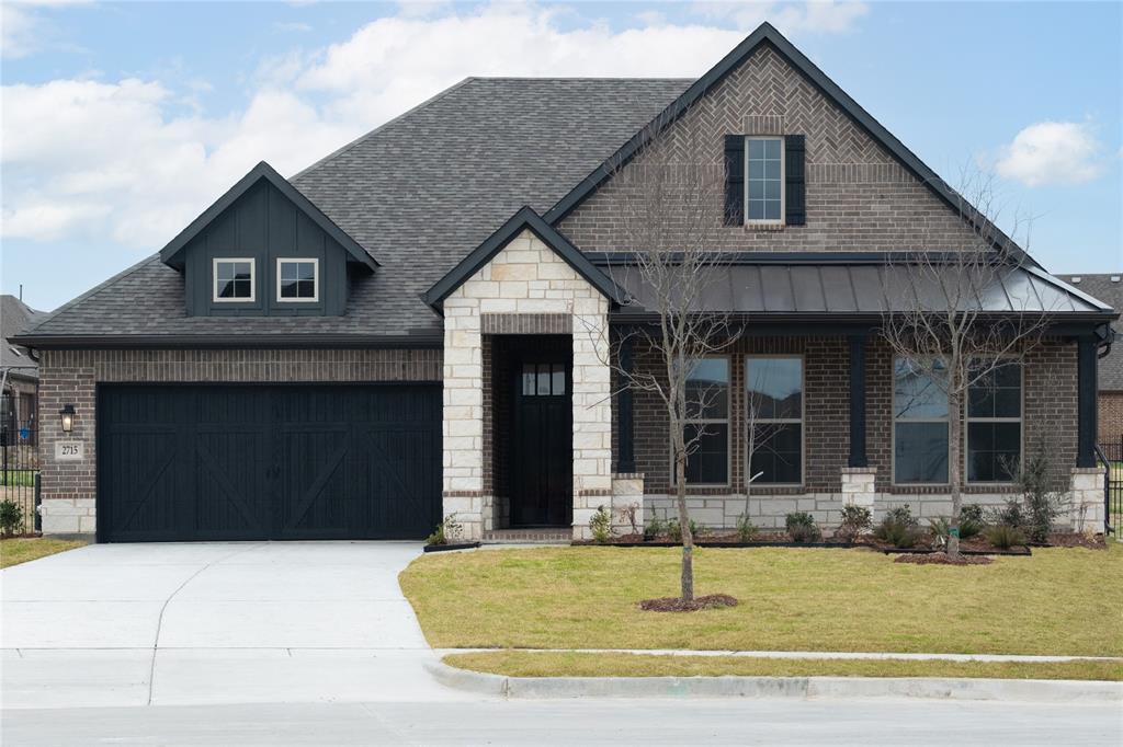 2715 Triumph Court Heath, TX 75126 - Photo 29 of 30 a front view of a house with a yard