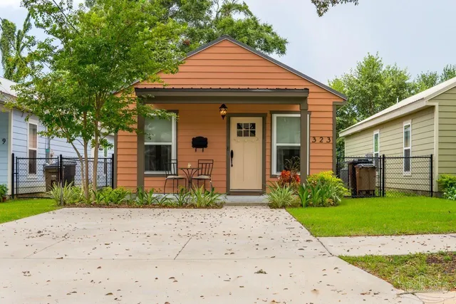 a front view of a house with a yard