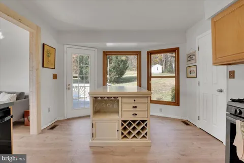 a living room with furniture and large windows