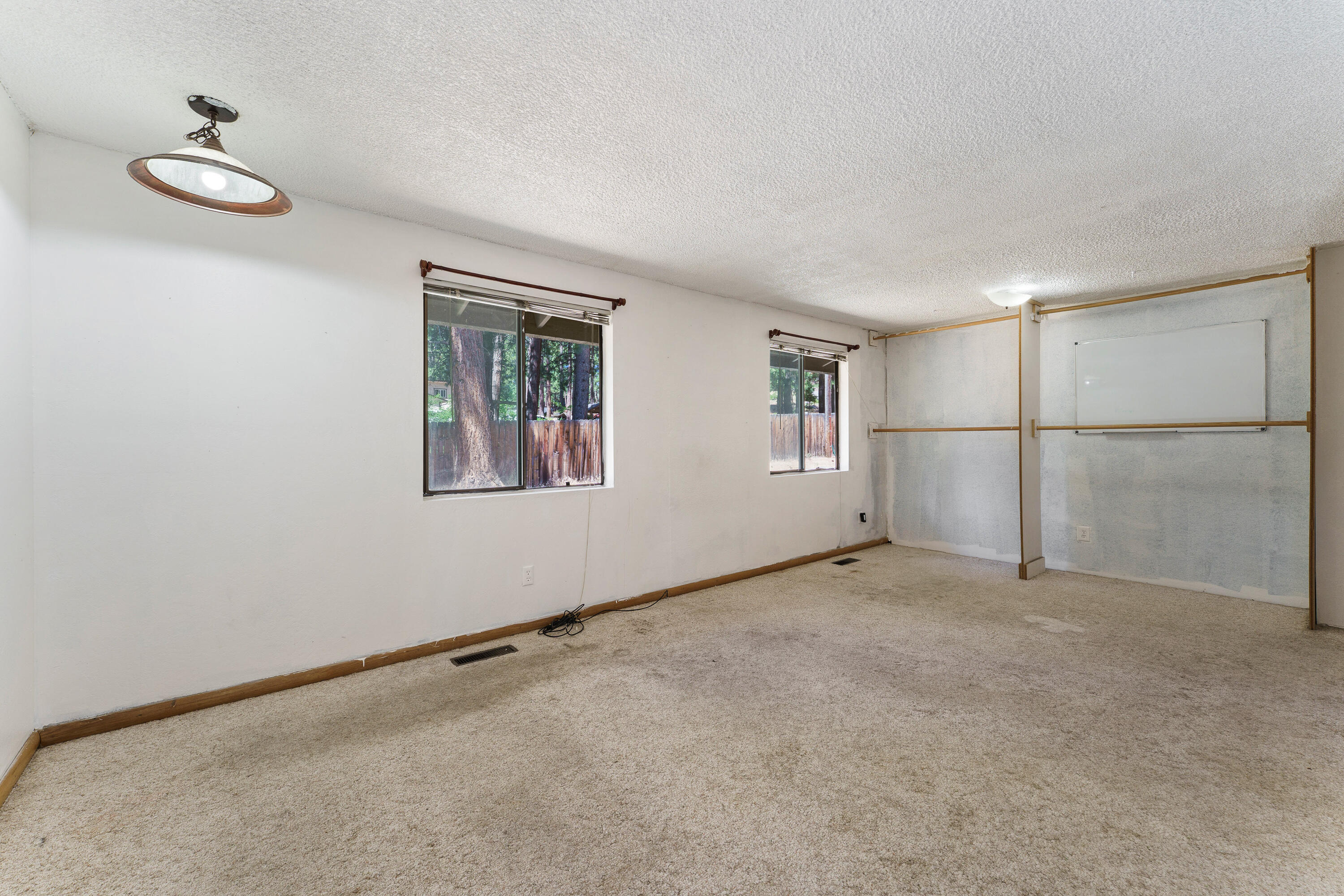 19143 Pumice Butte Road Bend, OR 97702 - Photo 10 of 19 a view of an empty room with a window