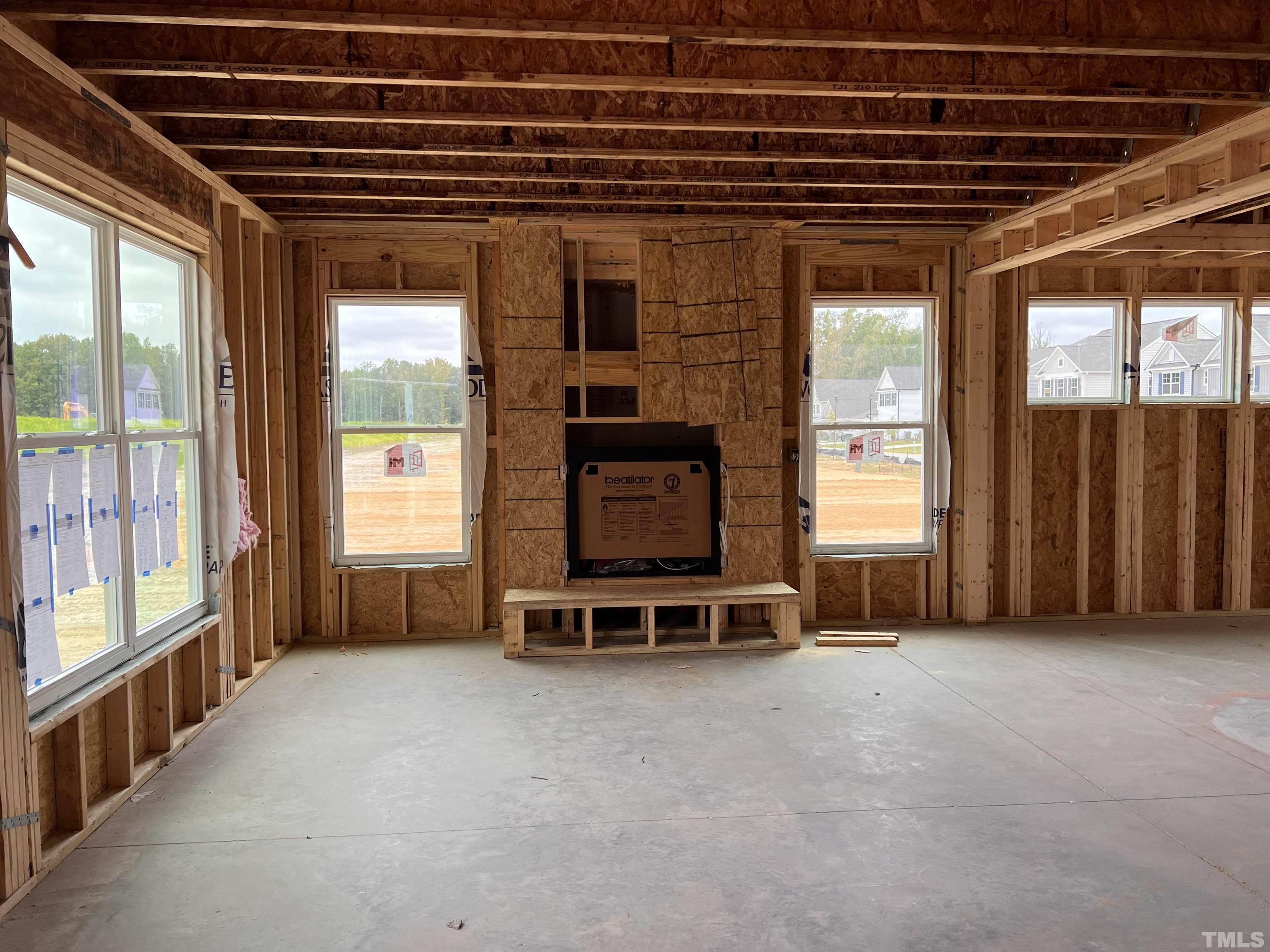 341 Highview Drive, Unit DF012 Benson, NC 27504 - Photo 4 of 7 a view of an empty room with furniture and windows