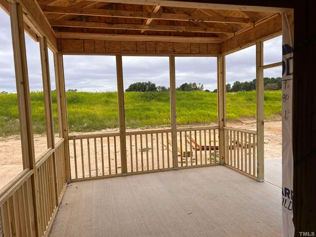 a sign board with buildings in the background