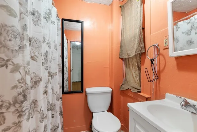 a bathroom with a toilet and a sink