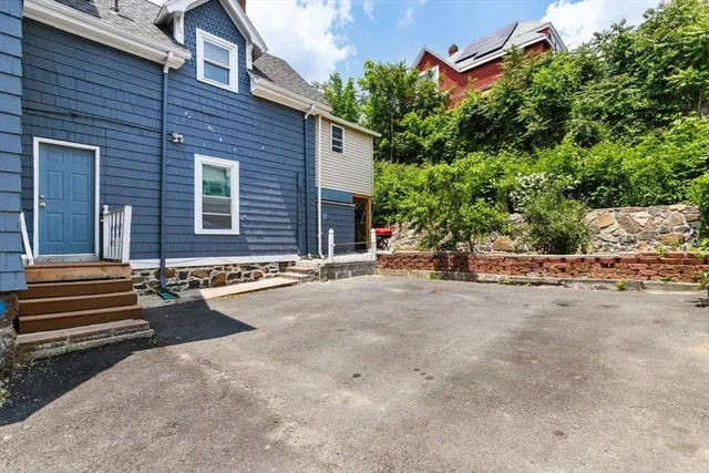 a view of a house with a street