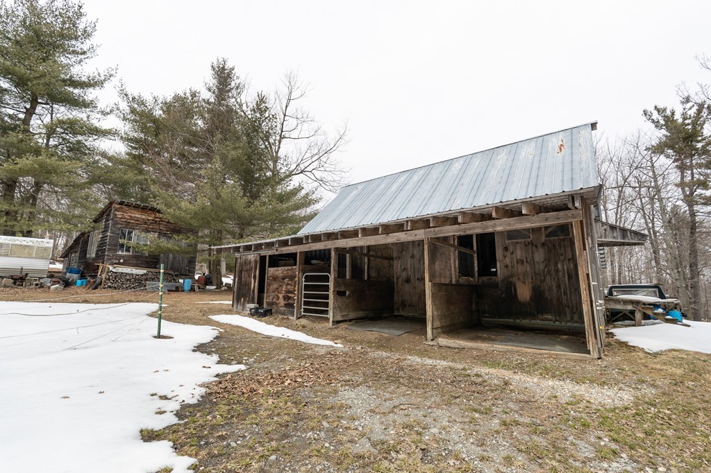 235 Bug Hill Road Ashfield, MA 01330 - Photo 27 of 30 a view of a house with a yard and garage
