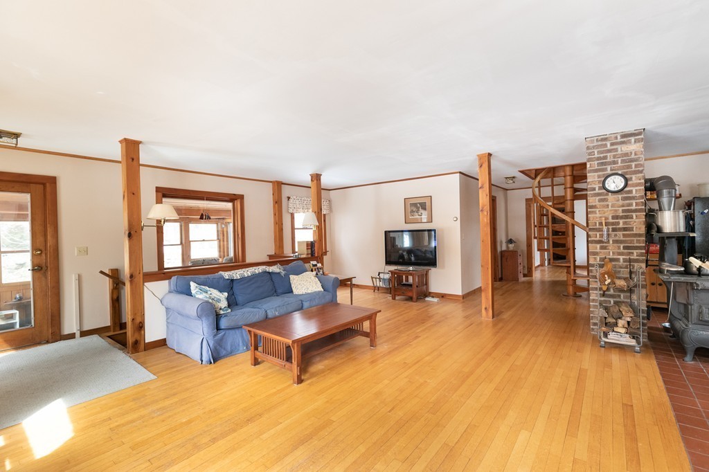 235 Bug Hill Road Ashfield, MA 01330 - Photo 4 of 30 a living room with furniture and a flat screen tv