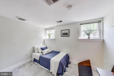 a bedroom with a bed and a closet