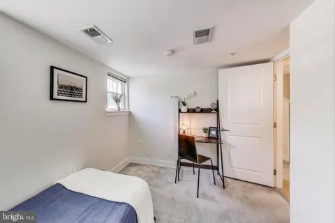 a living room with furniture and rug