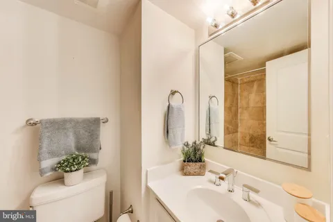 a bedroom with a bed and a table in it