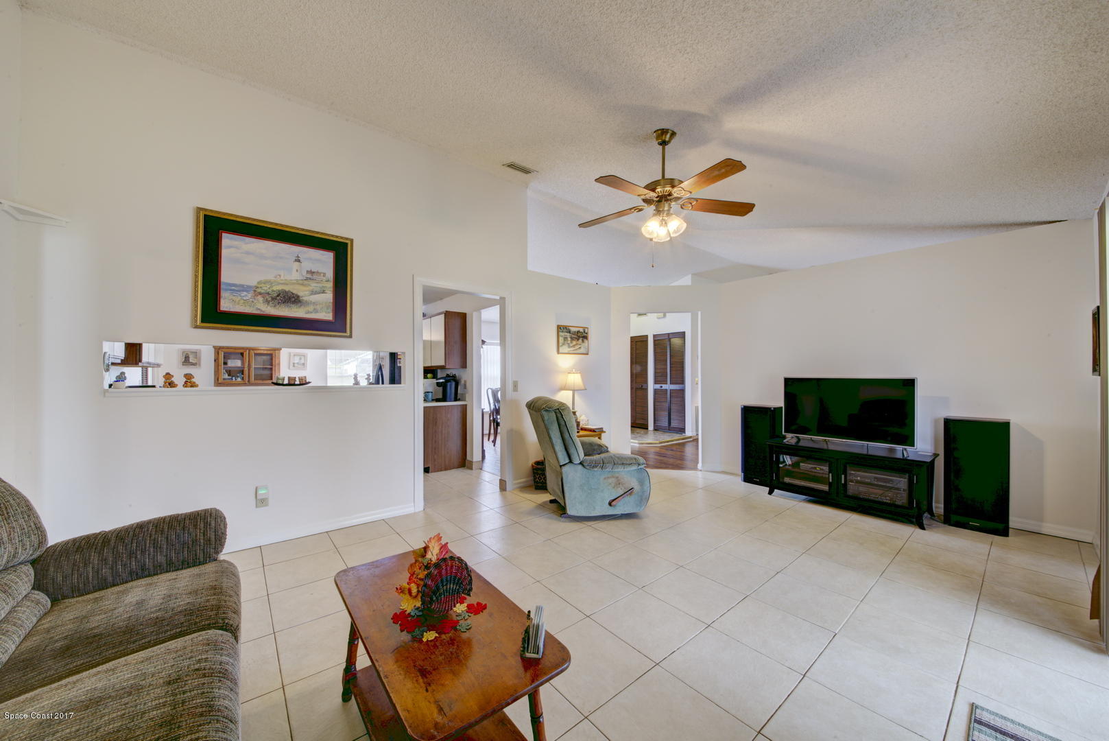 6670 Cairo Road Cocoa, FL 32927 - Photo 17 of 39 Family Room with pass thru to Kitchen