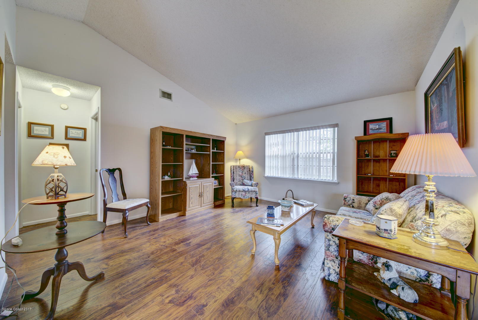 6670 Cairo Road Cocoa, FL 32927 - Photo 22 of 39 Living Room with Wood Laminate Floor