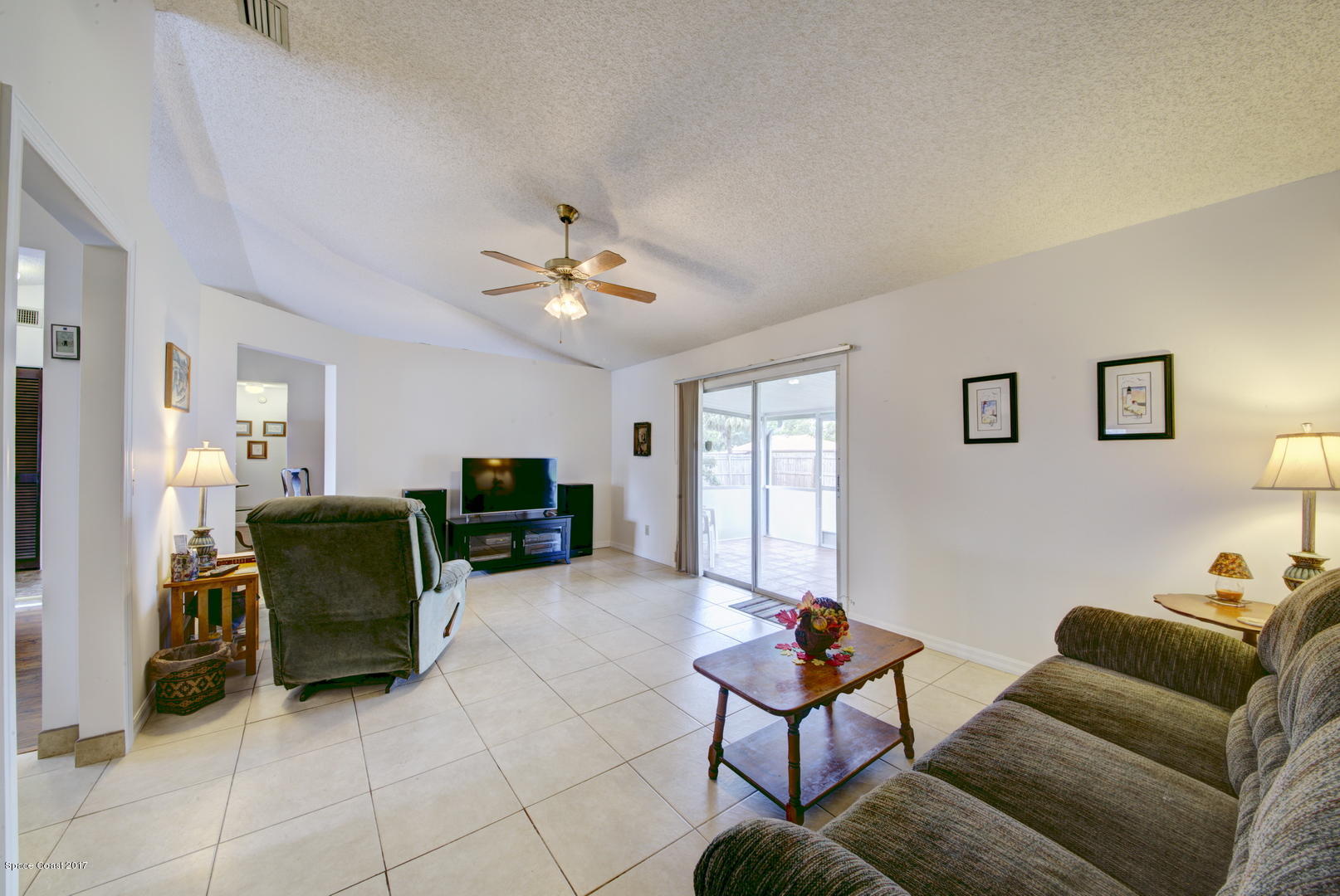 6670 Cairo Road Cocoa, FL 32927 - Photo 34 of 39 Family Room access to Patio