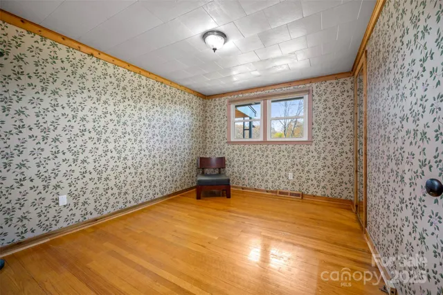 a view of a livingroom with furniture and staircase