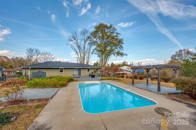a view of a yard with large trees