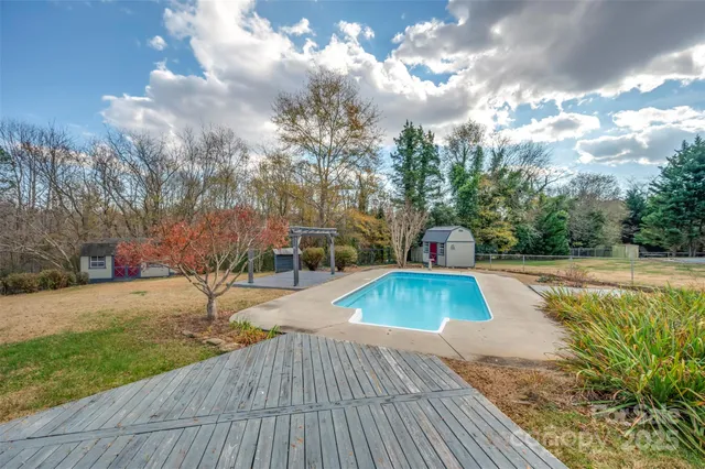 a view of a porch with a table and chairs