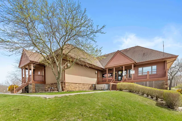 a view of a backyard with sitting area