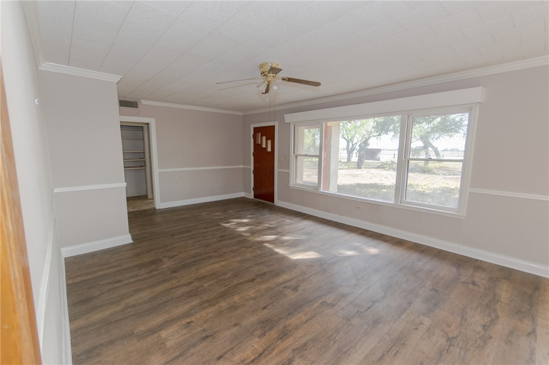 3867 Highway 59 George West, TX 78022 - Photo 12 of 40 wooden floor in an empty room with a window