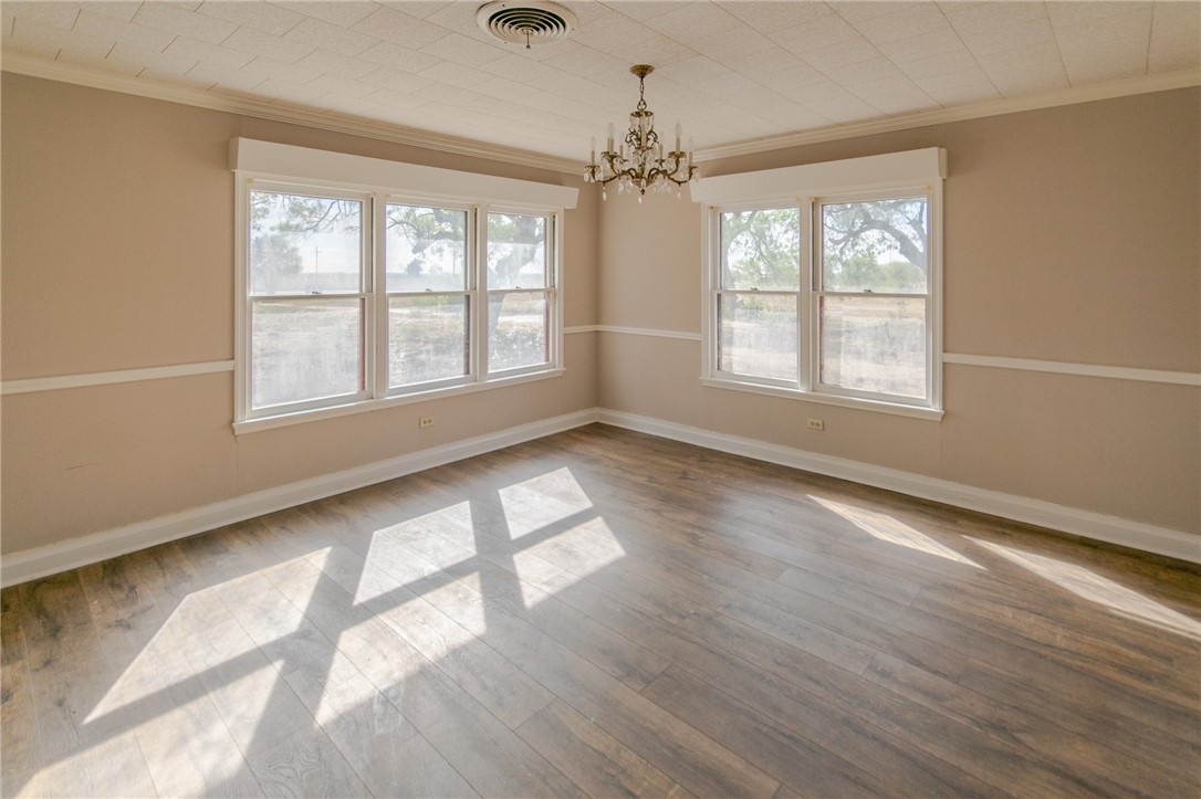 3867 Highway 59 George West, TX 78022 - Photo 14 of 40 a view of an empty room with wooden floor and a window