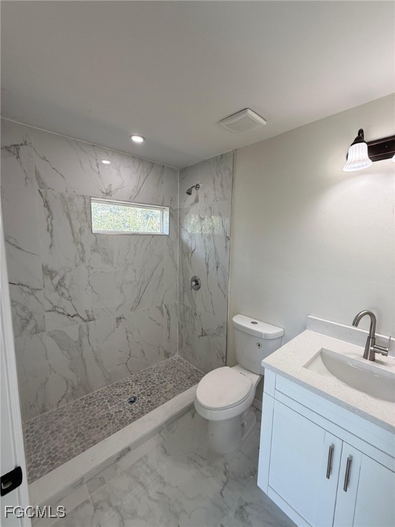 4657-4659 26th Street Southwest Lehigh Acres, FL 33973 - Photo 18 of 24 a bathroom with a sink toilet and shower