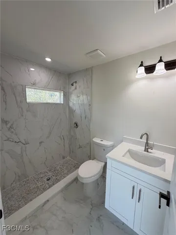 a view of an house with backyard space and garden