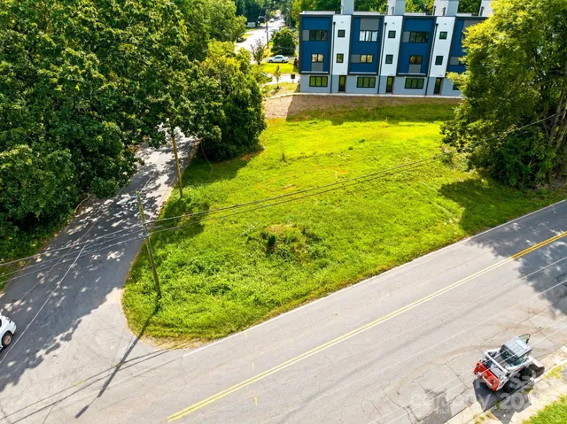 a view of a swimming pool with a garden and plants