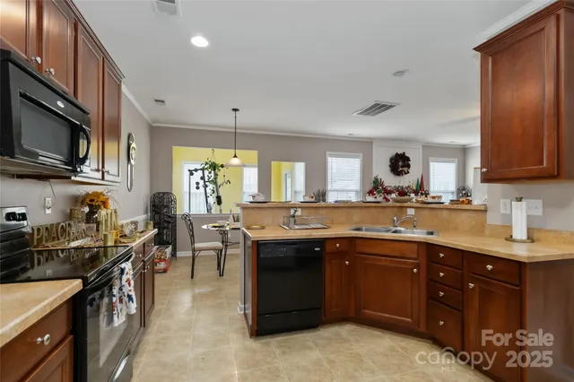a kitchen with lots of counter top space a sink and appliances