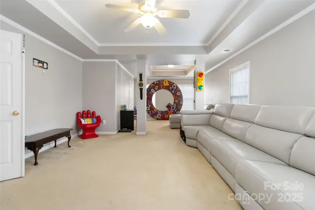 a living room with furniture and a lamp