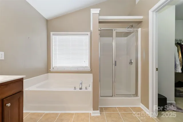 a white bath tub sitting next to a window