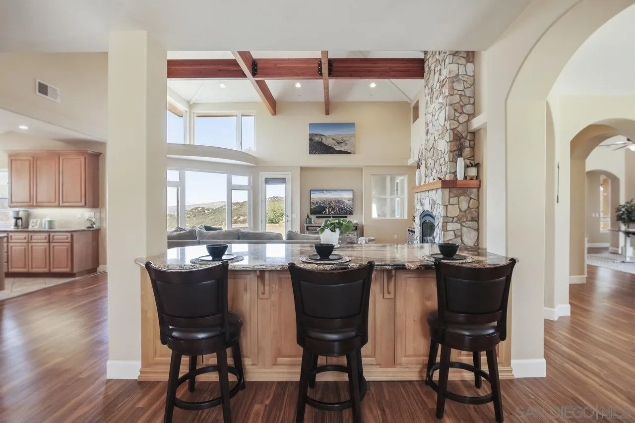 13192 Yerba Valley Way Lakeside, CA 92040 - Photo 15 of 58 a view of a dining room with furniture and wooden floor